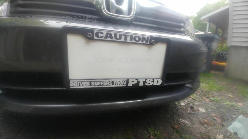 CAUTION DRIVER SUFFERS FROM P.T.S.D. POST TRAUMATIC STRESS License Plate Frame